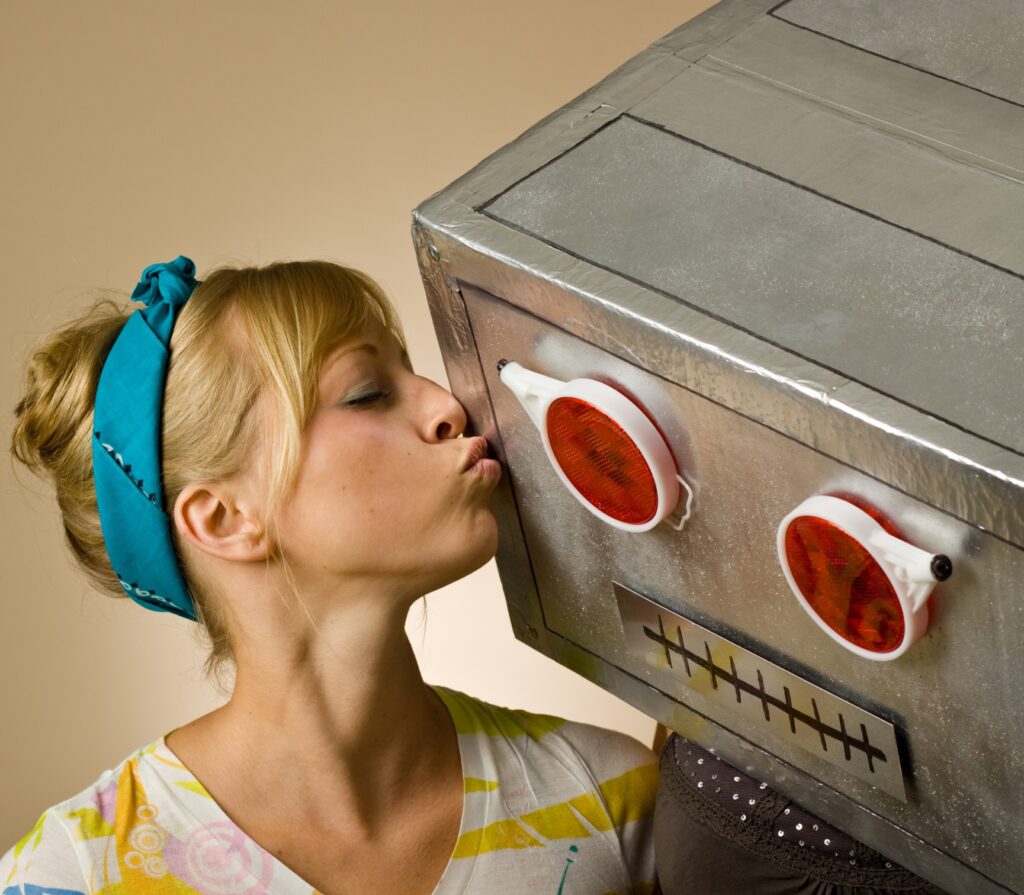 woman kissing robot